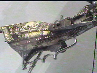 The inlaid stock of an atique gun
