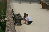 Playing in the sand under the Roman walls