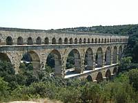 An aquaduct on the top and a bridge in the middle
