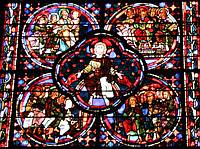 A segment from the Apocalypse window.  The central figure is Christ distributing the flames of Pentecost and the surrounding circles host the 12 disciples and the 12 patriarches.