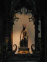 Black Madonna: 12C, 27" tall walnut carving.  It was covered with silver plate and several tarnished fragments of that survive.