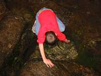 Exploring a tide pool--hope there is nothing sharp in there