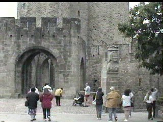 The entrance to the city and the bust of Madame Carcassonne